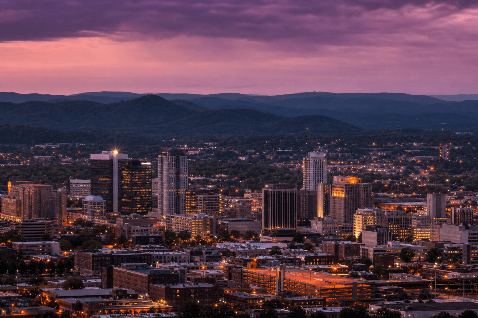 Birmingham Alabama skyline at dusk with Appalachian foothills in the background