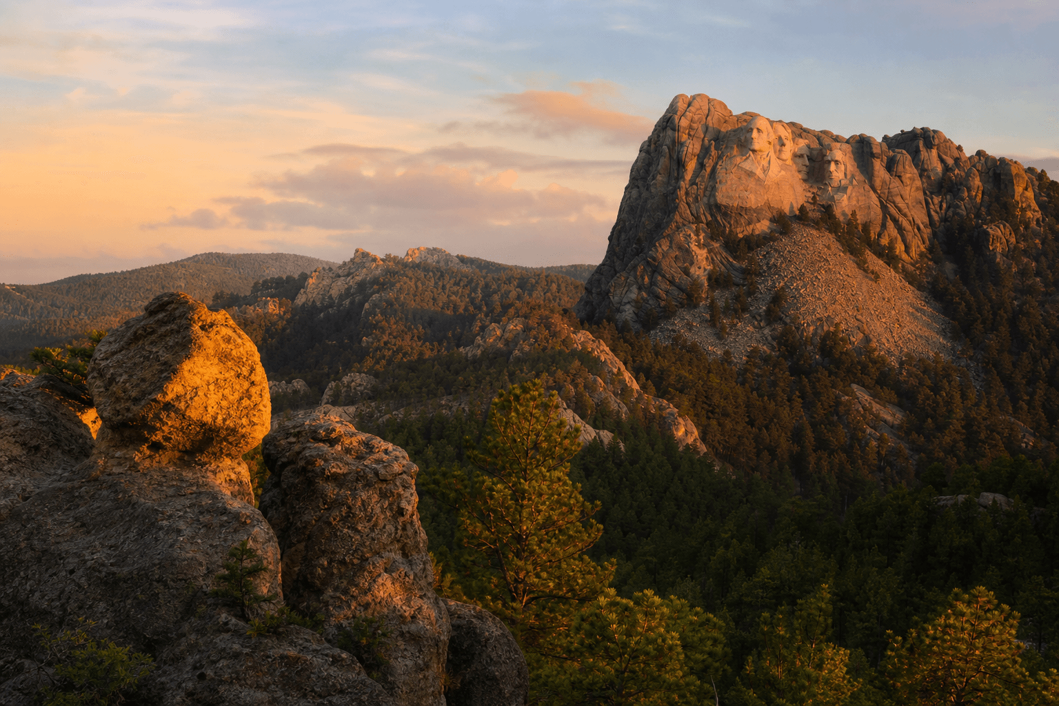 South Dakota Black Hills landscape at golden hour with Mount Rushmore visible in the distance