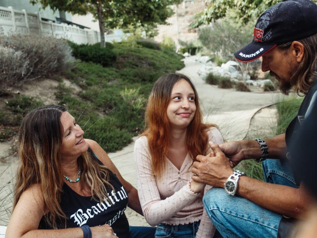 Three people having a heartfelt talk