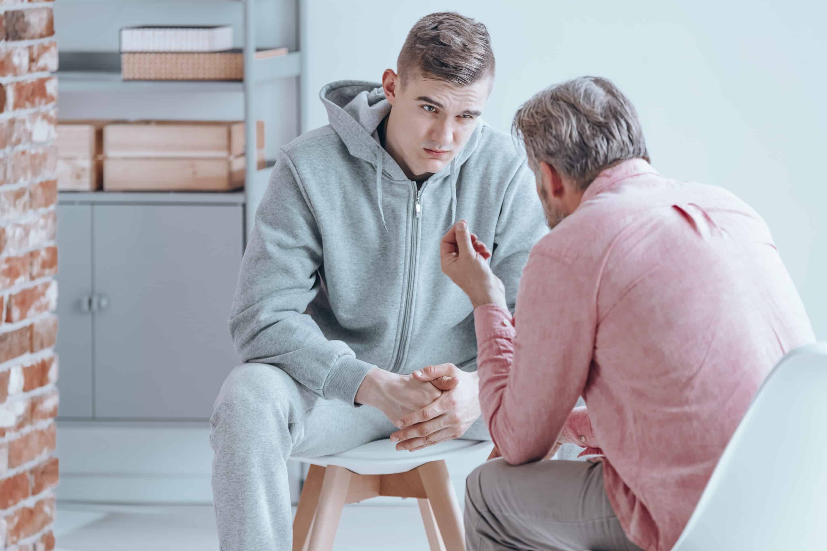 Teenager talking with counselor